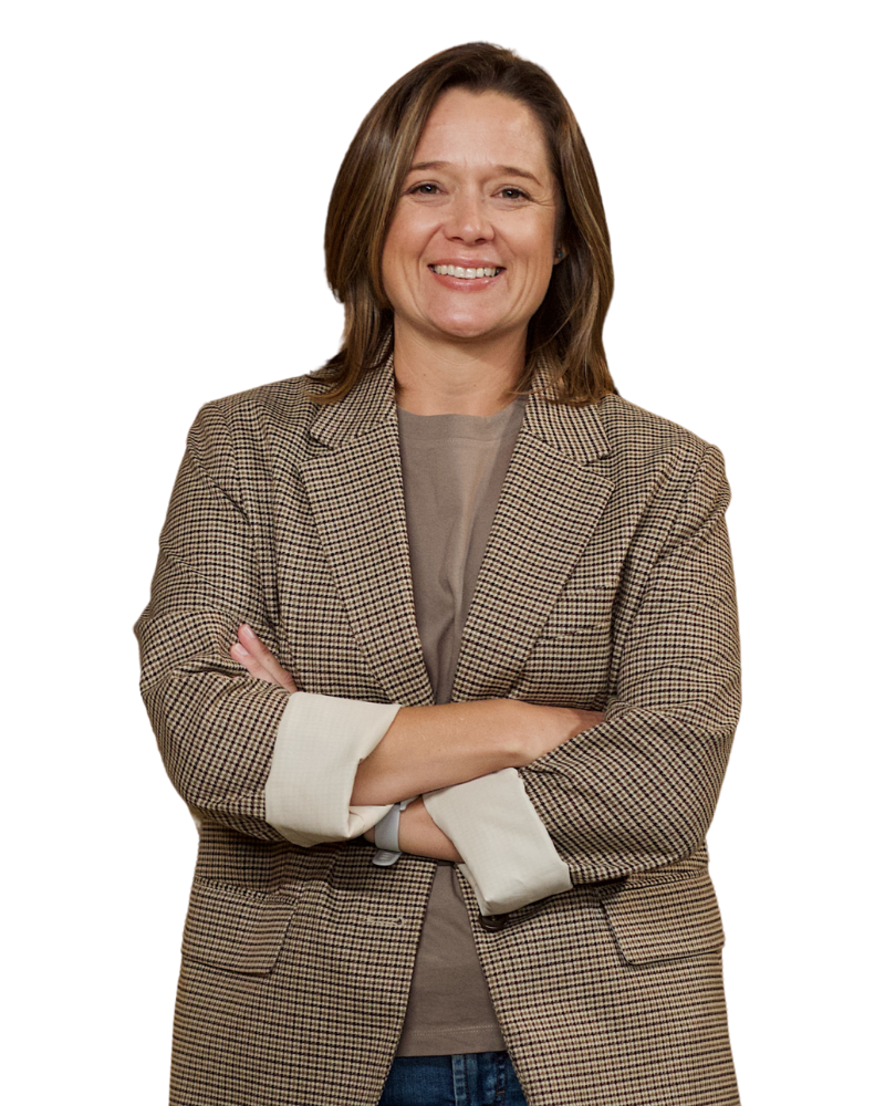 Clarise Sciocatti-Langeveldt in a blazer, smiling with arms crossed