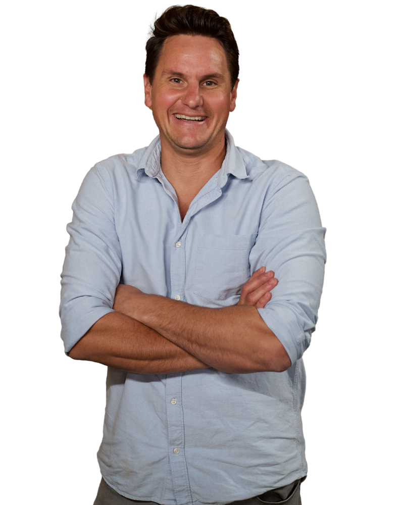 Jasper Wickens with arms crossed, smiling.