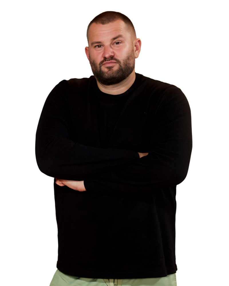 Neville Lotz with arms crossed, looking at the camera.