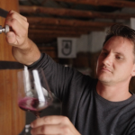 Jasper Wickens pouring wine