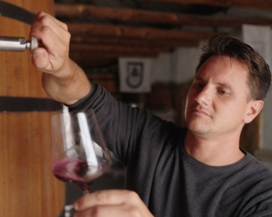 Jasper Wickens pouring wine
