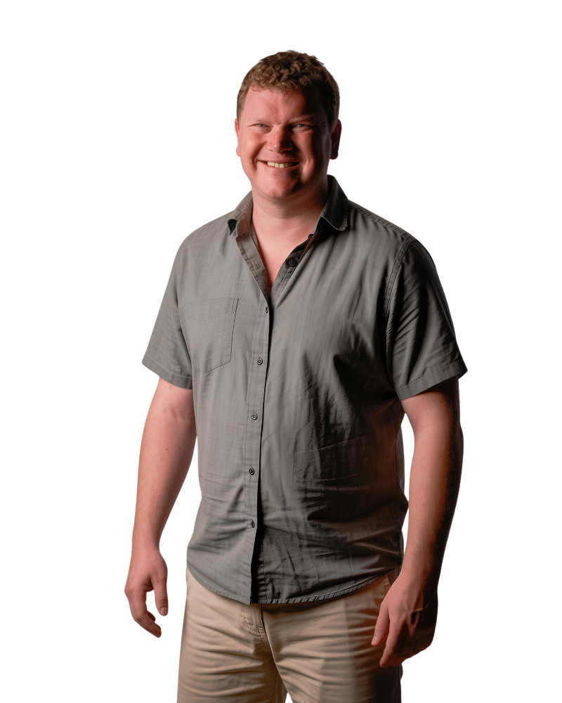 Andrew Mellish in a gray short-sleeved shirt and khaki shorts
